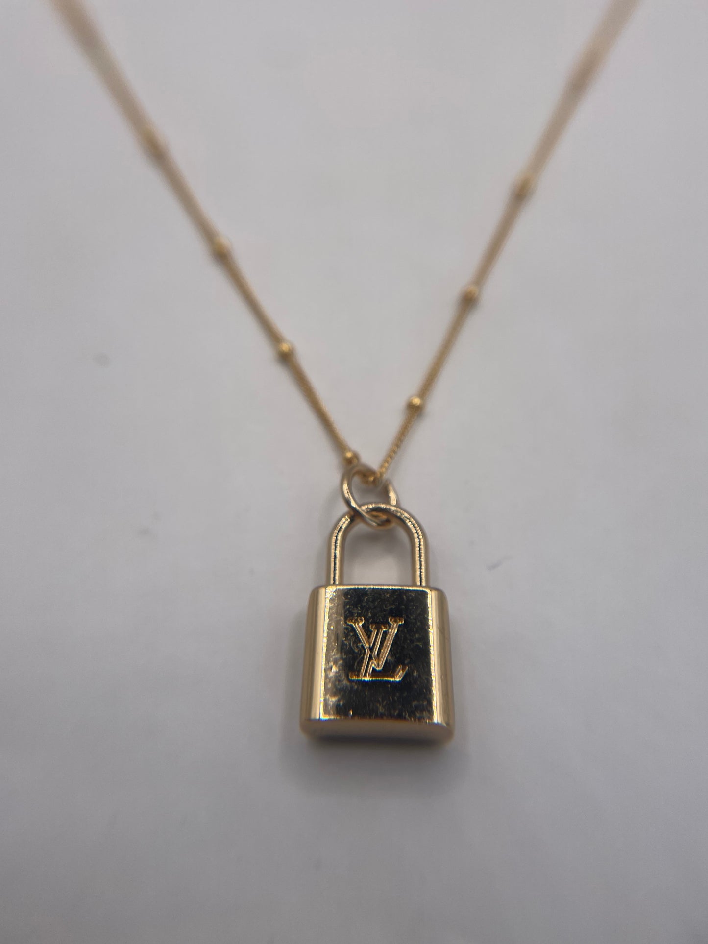 AUTHENTIC LOUIS VUITTON GOLDTONE ZIPPER PULL BUTTON NECKLACE