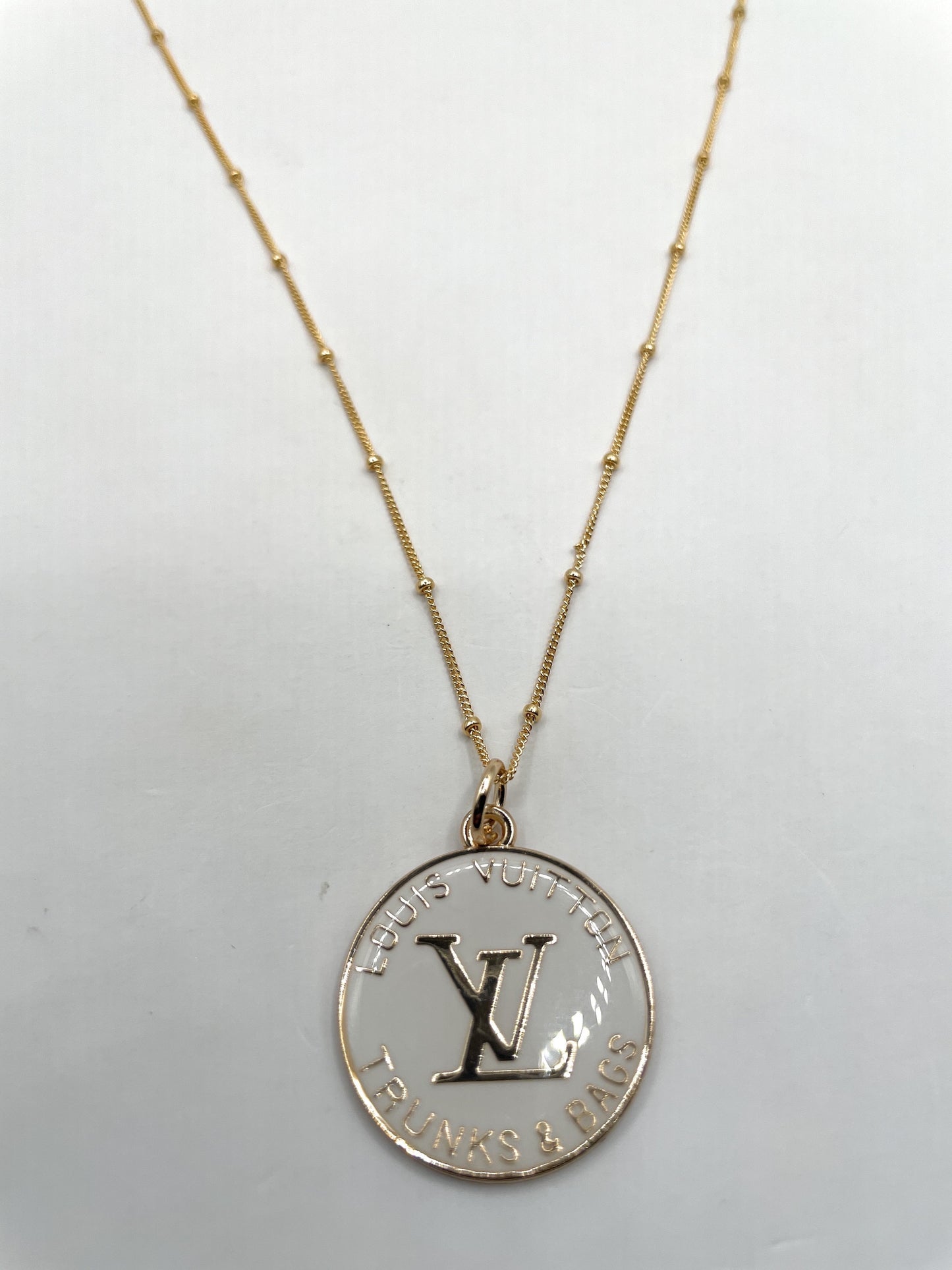 AUTHENTIC LOUIS VUITTON WHITE AND GOLD ZIPPER PULL BUTTON NECKLACE