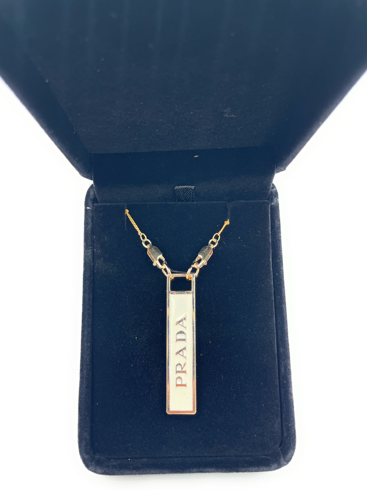 AUTHENTIC PRADA WHITE AND GOLD ZIPPER PULL BUTTON NECKLACE