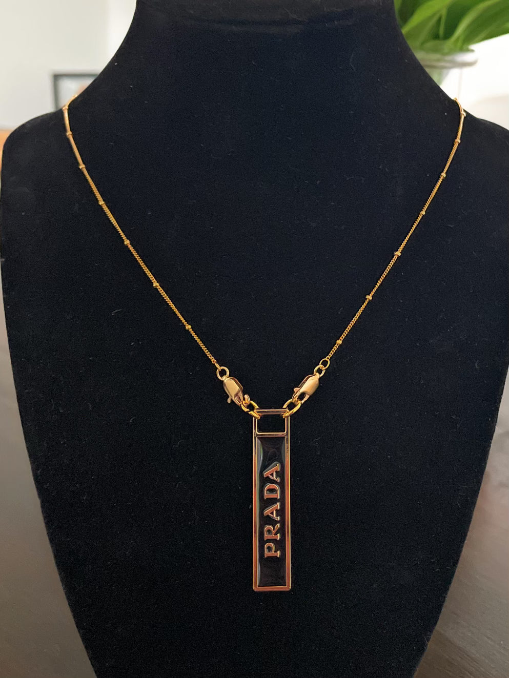 AUTHENTIC PRADA BLACK AND GOLD ZIPPER PULL BUTTON NECKLACE